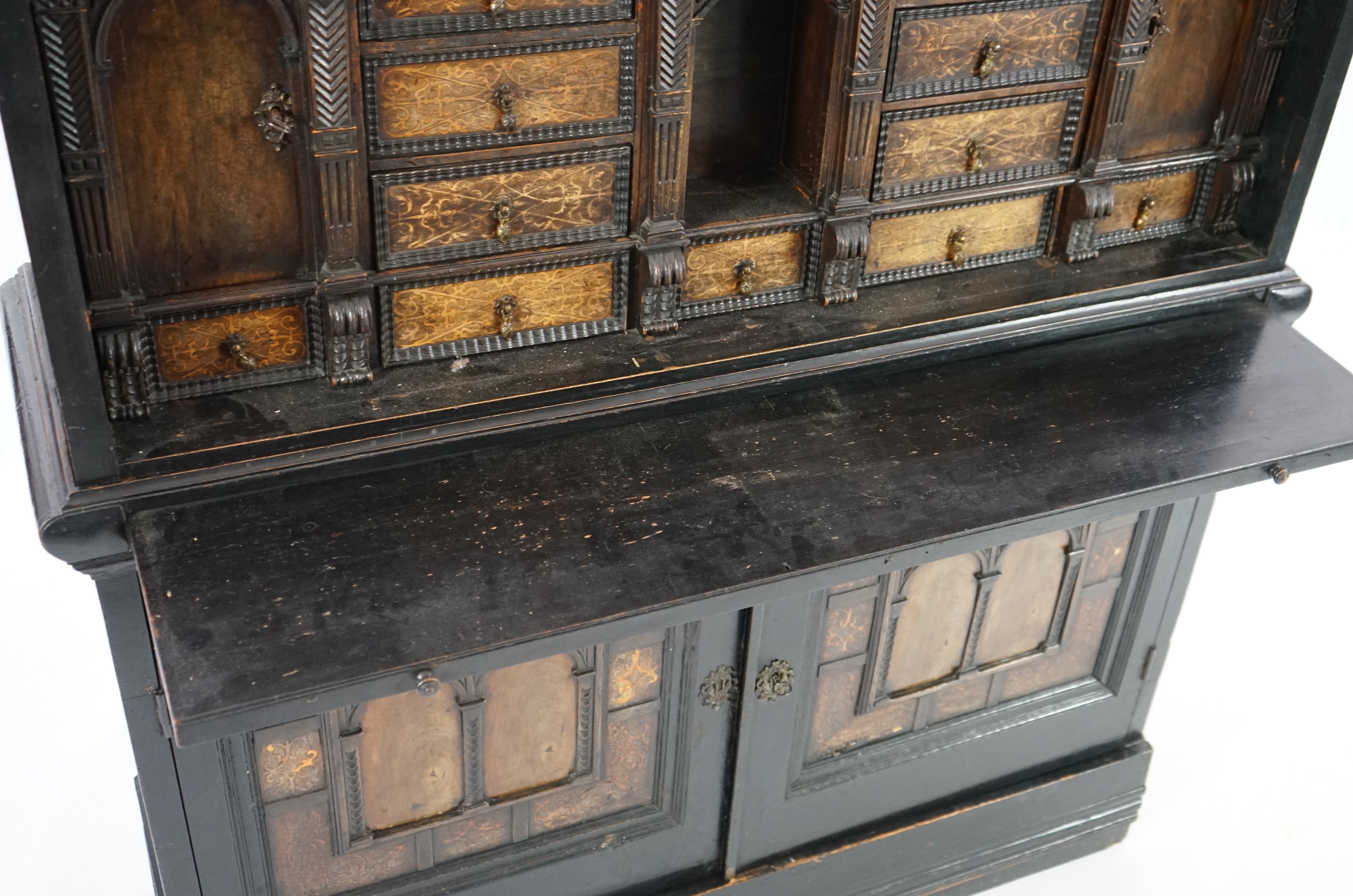 An 18th century and later Dutch walnut ebonised and marquetry inlaid collector's cabinet on stand